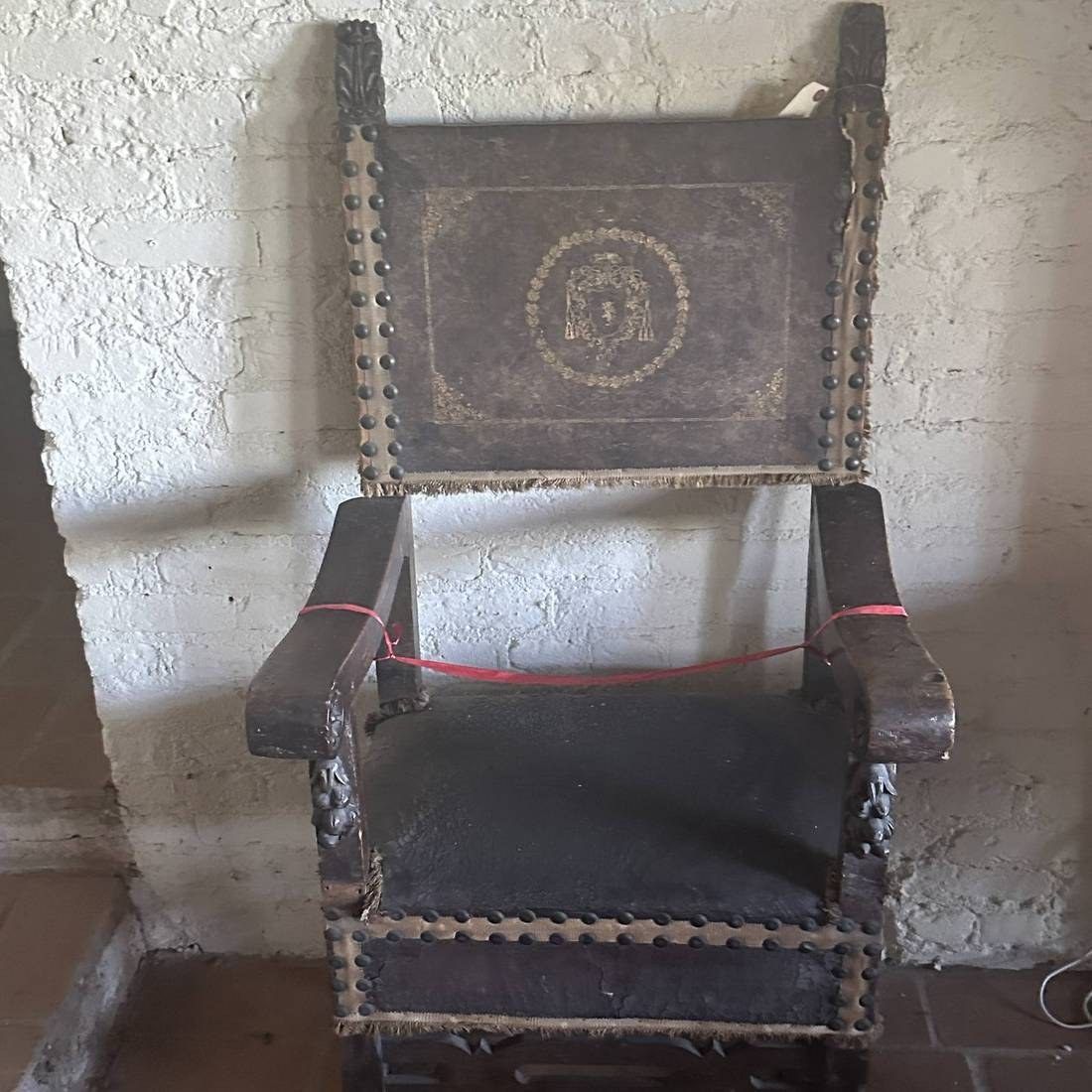 Antique carved armchair identified for resale