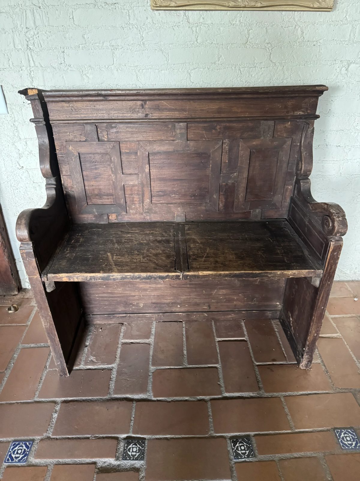 Carved antique bench set aside for sale during the estate cleanout