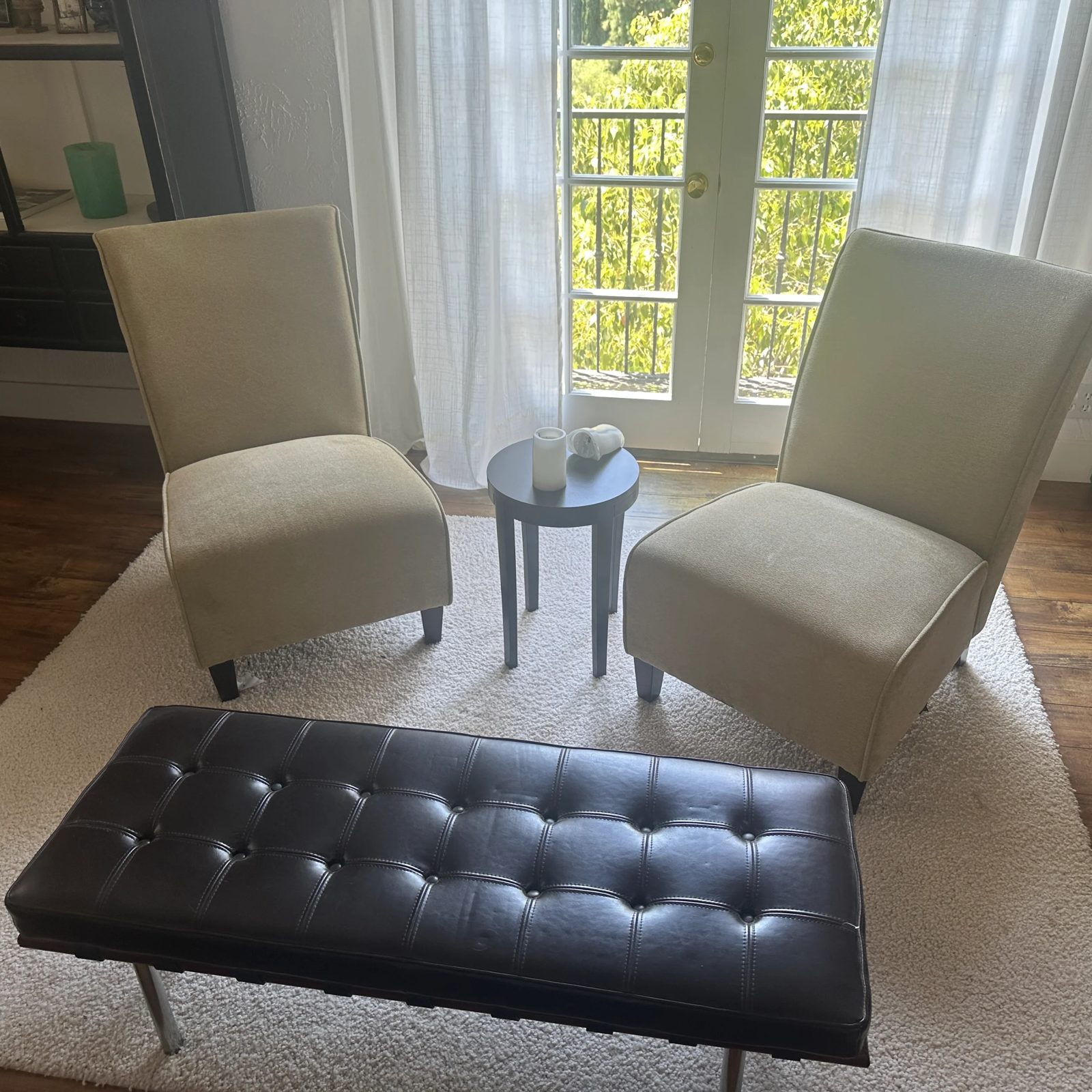 Living room chairs and bench sorted for sale during a home cleanout